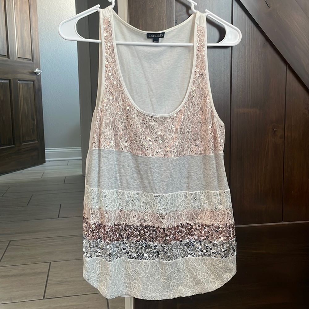 Only Worn a few times looks brand new tank top with sequin & lace detail.